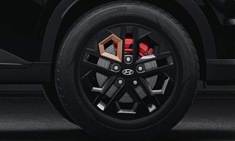 Black painted alloy wheels with red front brake calipers