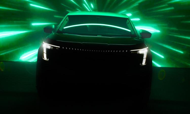 Skoda Three-Row Electric SUV Teased Ahead Of Debut छाायदार टीज़र तस्वीरें आगामी तीन-रो इलेक्ट्रिक एसयूवी की पहली झलक देती हैं.