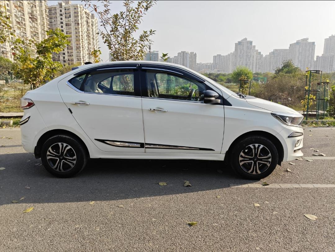 यूज़्ड 2024 टाटा टीगोर, Noida New Delhi 5 यूज़्ड 2024 टाटा टीगोर, Noida New Delhi 5